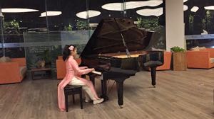 Ahe (14) having fun at the piano during a break at a choir concert at the Flamingo Resort, Dai Lai, Vietnam in January 2018. Part 1.